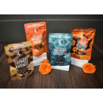 Four bags of chocolate-covered almonds with orange flowers in front