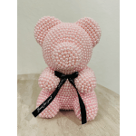 Pink pearl teddy bear with a black ribbon bow