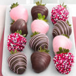 Tray of chocolate-covered strawberries decorated in pink and white