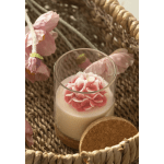 Pink flower candle in a clear glass holder