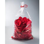 Bag of red rose petals tied with a red ribbon