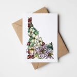 Floral greeting card with a colorful Alaska-shaped bouquet illustration