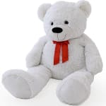 White teddy bear with a red ribbon bow