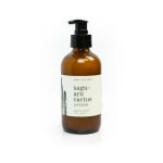Amber pump bottle of saguaro cactus lotion on a white background