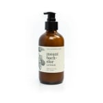 Amber pump bottle of lotion with a cream label