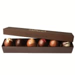 Box of assorted chocolate truffles in a brown gift box