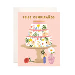 Birthday card with a floral cake illustration and Spanish text