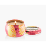Lit floral-pattern candle in a decorative tin with matching lid