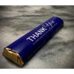 Blue thank-you candy bar wrapper on a gray surface