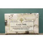 Bar of goats milk soap in printed paper wrapping