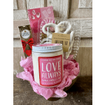 Gift basket with a candle, chocolates, and white chocolate pretzels
