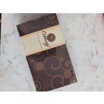 Box of assorted chocolates on a marble surface