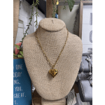 Gold heart pendant necklace on a burlap display bust