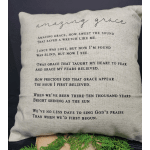 Decorative pillow with the words "amazing grace" and printed hymn text