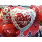 Heart-shaped Valentine’s Day balloons in red, pink, and white