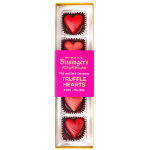 Box of heart-shaped chocolate truffles in pink packaging
