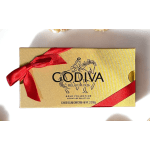 Gold Godiva chocolate box tied with a red ribbon