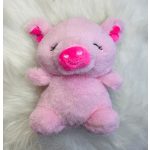 Pink plush pig toy with a bright fuchsia snout on a white furry background