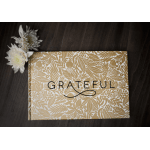 White flowers beside a patterned gratitude box
