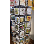 Rotating rack of greeting cards with floral and birthday designs