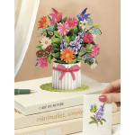 Pop-up bouquet card with colorful flowers and butterflies in a striped vase