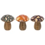 Three decorative mushroom figurines with autumn leaf patterns