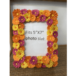 Colorful flower-covered photo frame holding a 5x7 picture