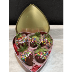 Heart-shaped box of chocolate-covered strawberries with colorful sprinkles