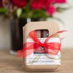 Box of salted caramels tied with a red ribbon