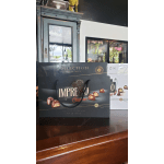 Gift bags of assorted chocolates on a wooden counter
