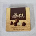 Box of Lindt gourmet truffles on a light surface
