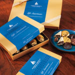 Boxes of assorted chocolates on a wooden table