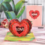 Heart-shaped rose arrangement with the word LOVE in the center