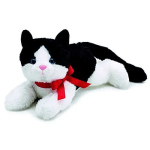 Black-and-white plush cat with a red ribbon bow