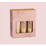 Pink boxed set of three jumbo lip tints with floral illustrations and a clear window.