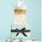 Stacked gift boxes with ribbon and tissue paper
