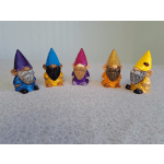 Five small colorful gnome figurines lined up on a tabletop