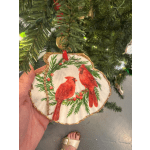 Shell-shaped Christmas ornament with two red cardinals