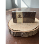 Box of assorted chocolates on a wood slice