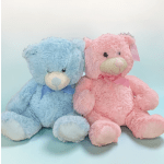 Two plush teddy bears, one blue and one pink, sitting side by side