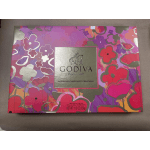Godiva assorted chocolate gift box with a pink floral pattern