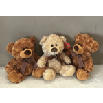 Three teddy bears with ribbon bows sitting together