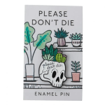Enamel pin card with a skull planter and potted succulents