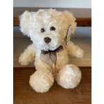Cream teddy bear with a brown ribbon bow