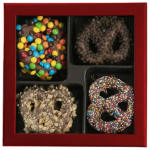 Box of four chocolate-covered pretzels with colorful candy toppings