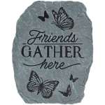 Gray stone plaque with butterflies and the words "Friends Gather here"