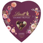 Heart-shaped Lindt gourmet truffles box with floral graphics and window showing assorted chocolates