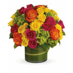 Bouquet of multicolored roses in a green glass vase