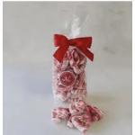 Clear bag of pink-and-white striped candies tied with a red bow