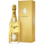 Gold champagne bottle beside a matching gift box